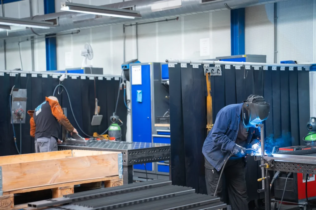 Welders at work in a Dutch metal workshop