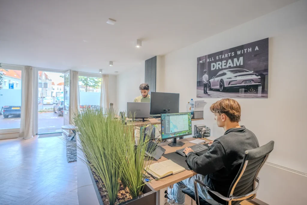 Kane and Nizar at their desks in the MrRecruit.Me office